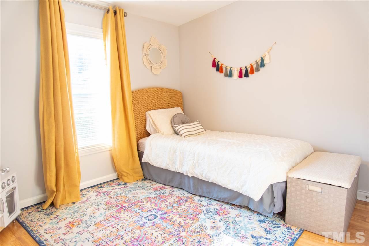 2421 Kearney Road Wake Forest, NC 27587 - Photo 18 of 30 a bedroom with a bed and a window