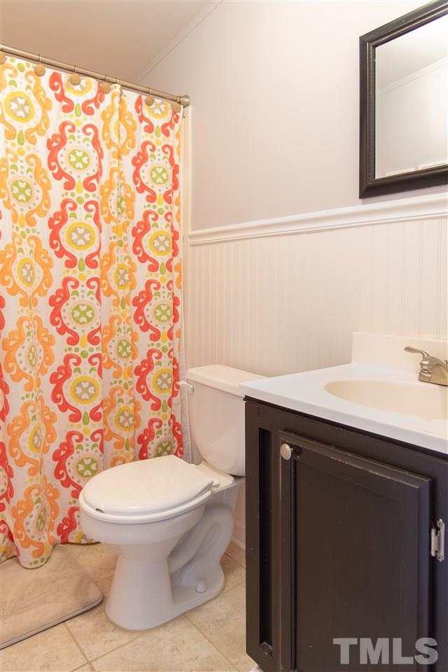 2421 Kearney Road Wake Forest, NC 27587 - Photo 19 of 30 a bathroom with a sink and a toilet