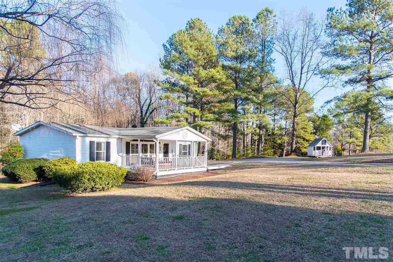 2421 Kearney Road Wake Forest, NC 27587 - Photo 3 of 30 a front view of a house with a garden
