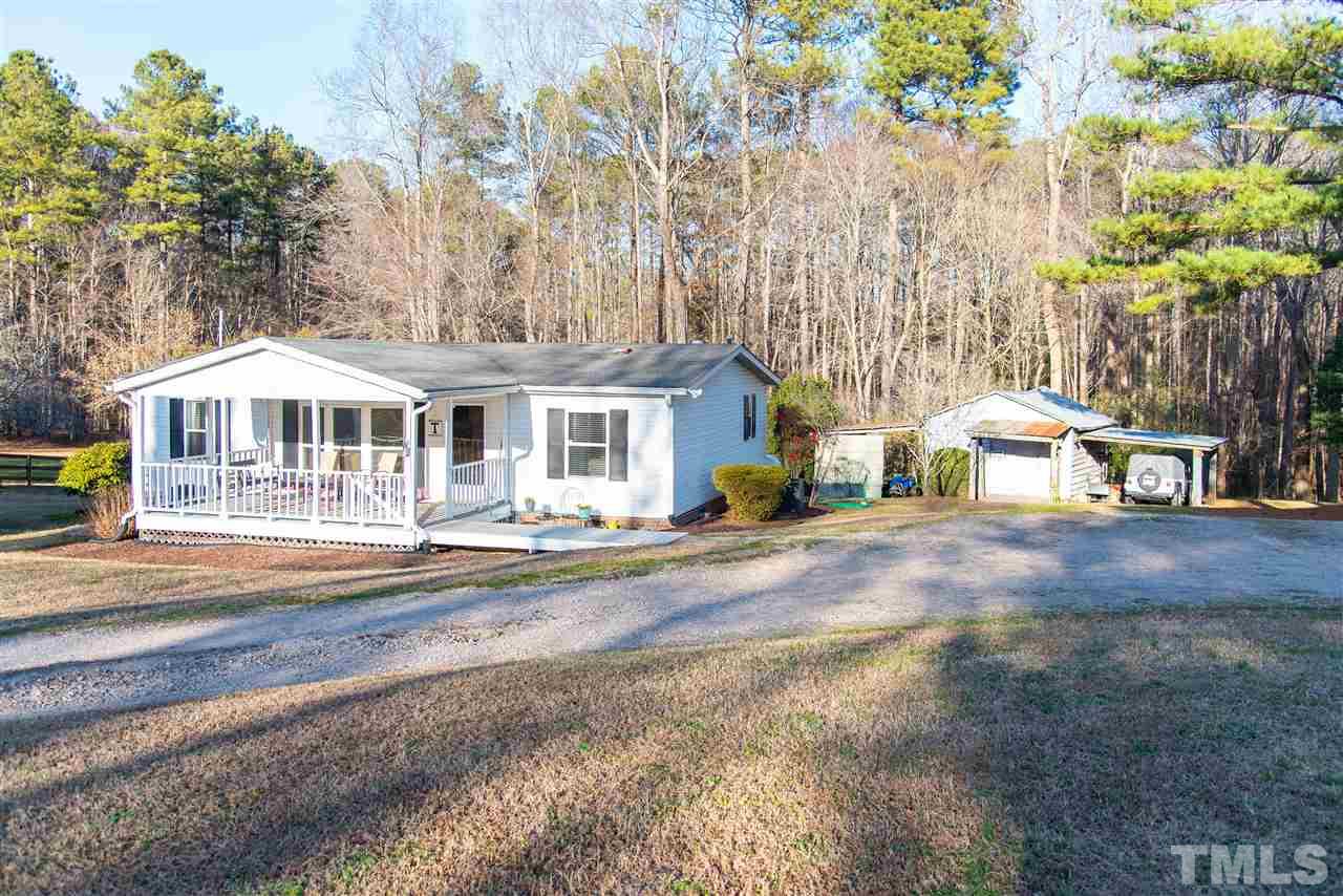 2421 Kearney Road Wake Forest, NC 27587 - Photo 24 of 30 a front view of a house with a garden
