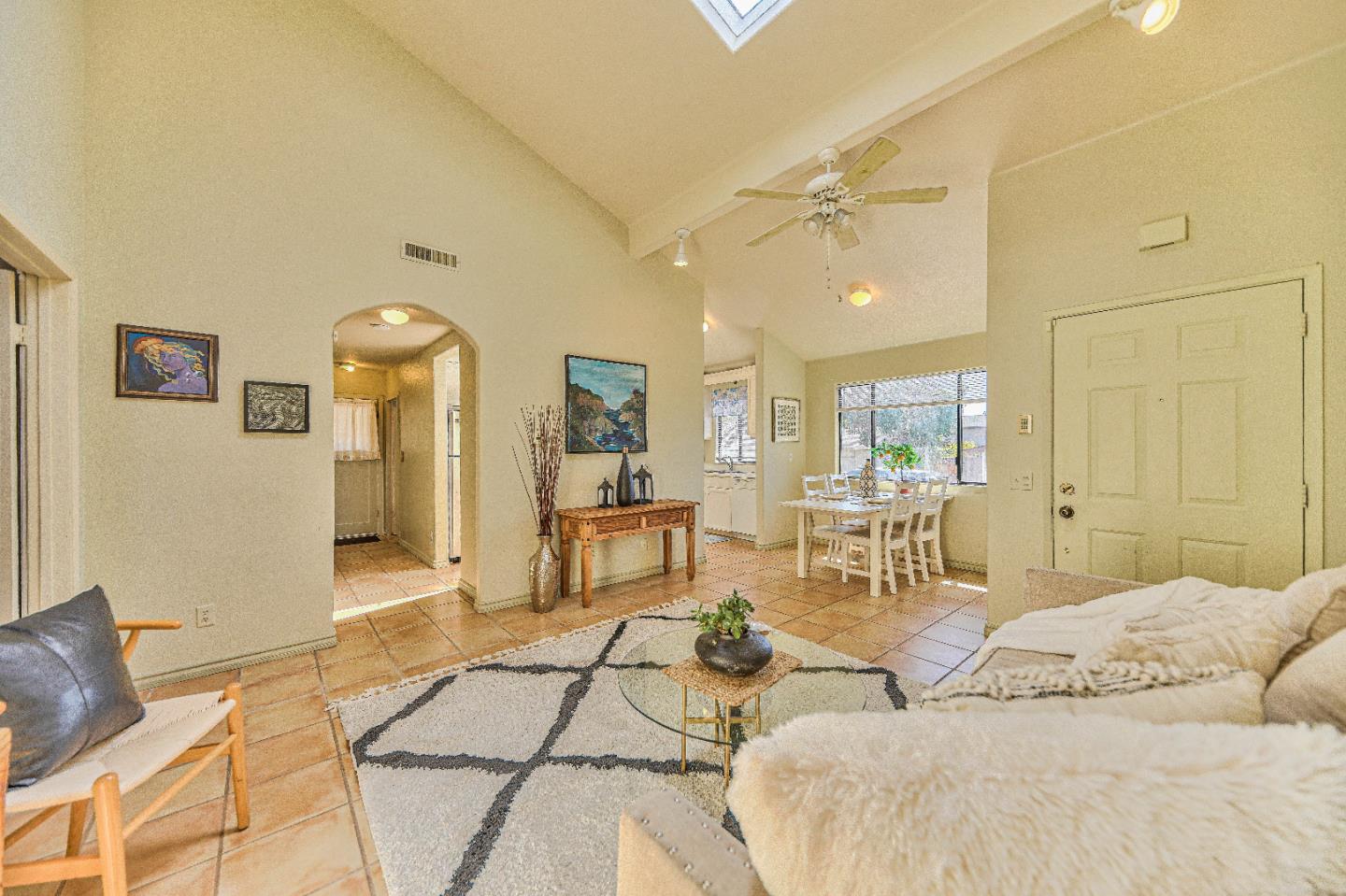 a living room with furniture and a table