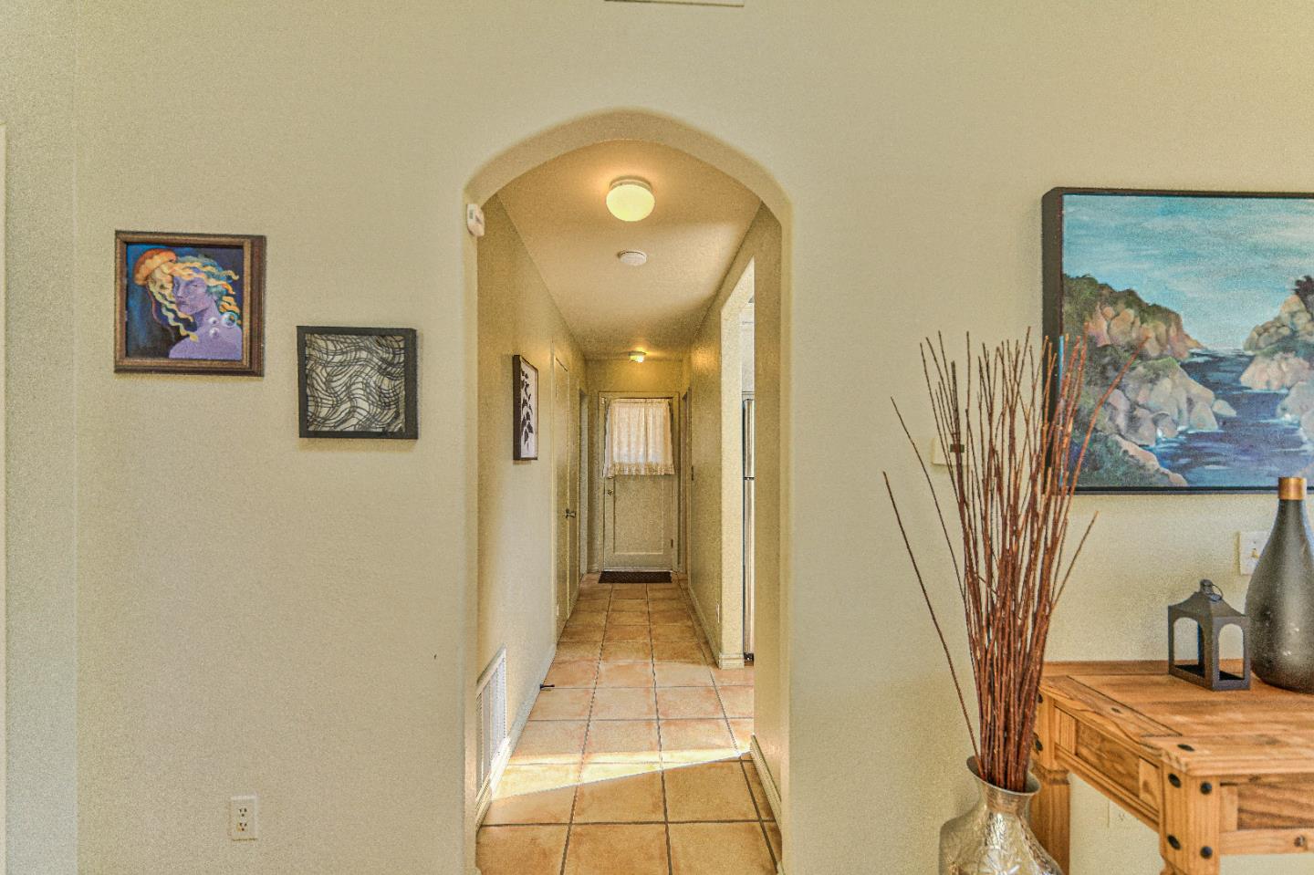 1868 Judson Street Seaside, CA 93955 - Photo 14 of 34 a view of a hallway with wooden floor and a bathroom