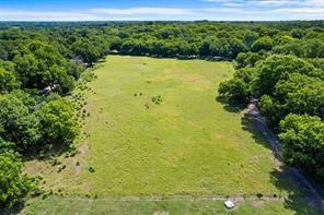 1213 South Houston School Road Lancaster, TX 75146 - Photo 6 of 8 a view of a lake from a yard