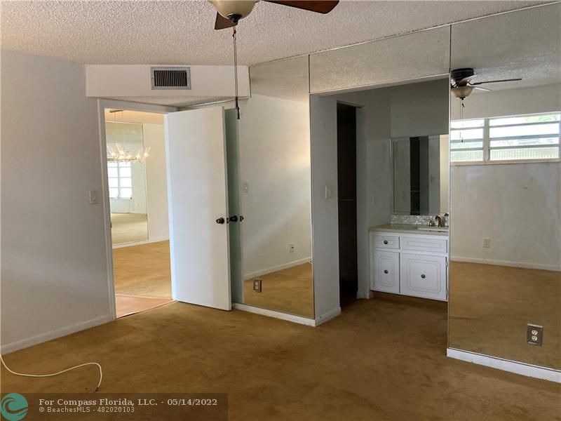 3541 Inverrary Drive, Unit 103 Lauderhill, FL 33319 - Photo 13 of 18 a view of a kitchen with refrigerator and window