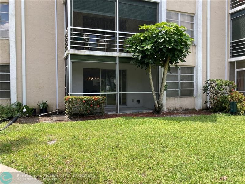 3541 Inverrary Drive, Unit 103 Lauderhill, FL 33319 - Photo 17 of 18 a view of house with backyard and a tub