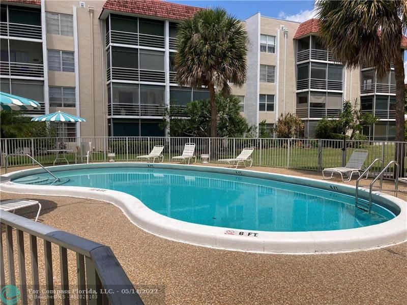 3541 Inverrary Drive, Unit 103 Lauderhill, FL 33319 - Photo 18 of 18 a view of swimming pool with a yard and sitting space