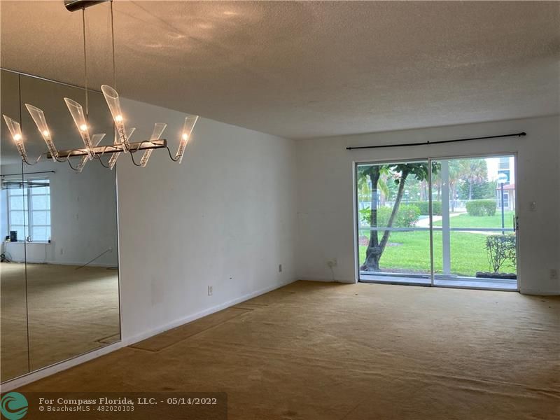 3541 Inverrary Drive, Unit 103 Lauderhill, FL 33319 - Photo 6 of 18 a view of empty room with floor to ceiling window