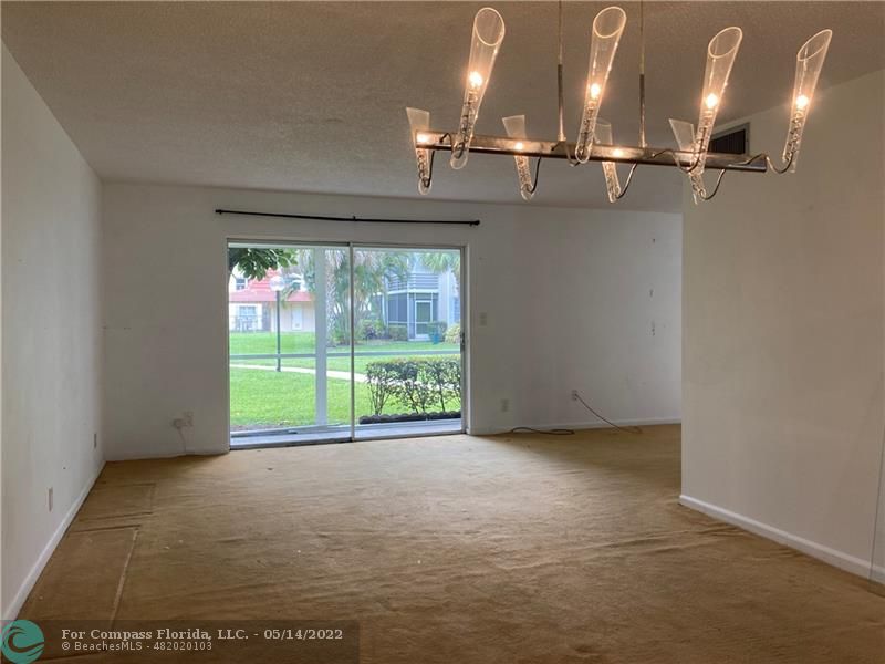 3541 Inverrary Drive, Unit 103 Lauderhill, FL 33319 - Photo 7 of 18 a view of an empty room with a window
