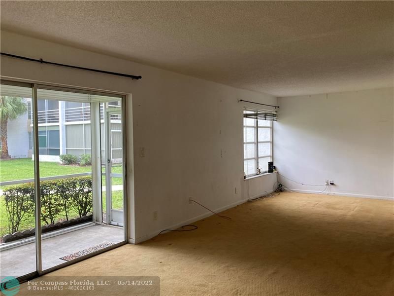 3541 Inverrary Drive, Unit 103 Lauderhill, FL 33319 - Photo 10 of 18 a view of an empty room with a window
