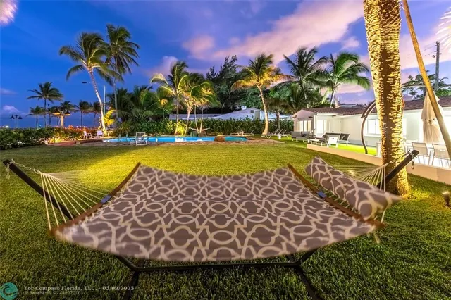 a view of a swimming pool with lounge chair