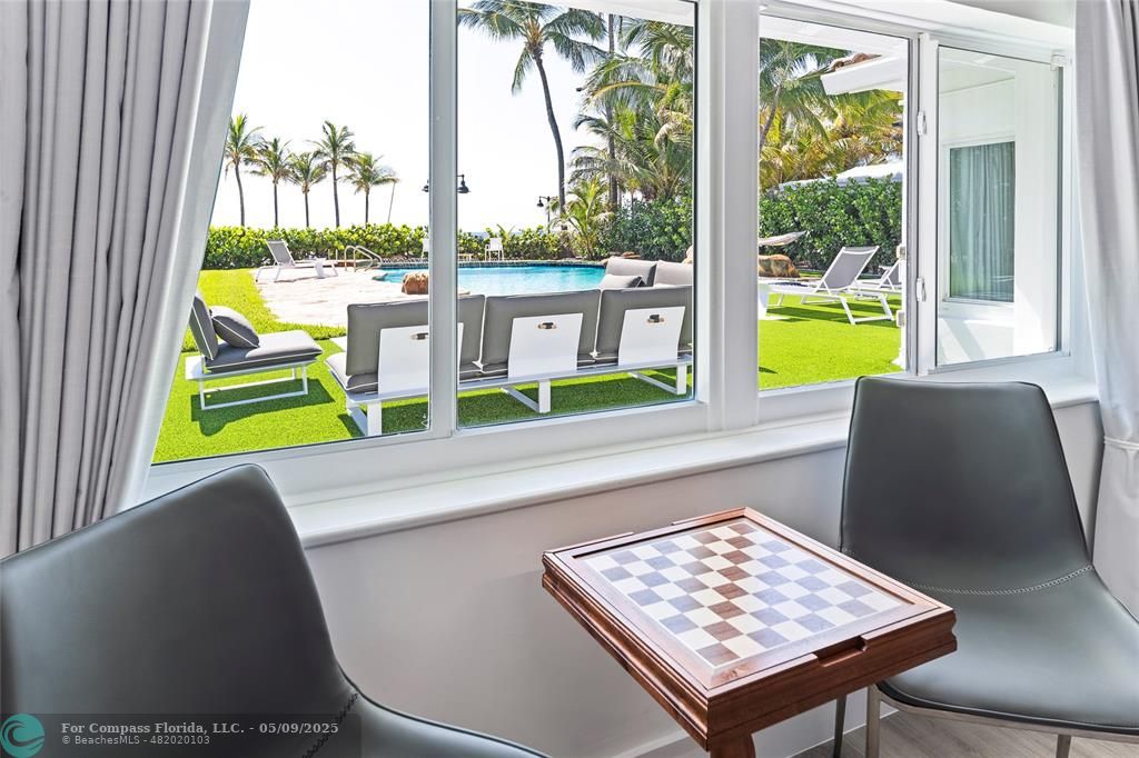 1663 North Fort Lauderdale Beach Boulevard Fort Lauderdale, FL 33305 - Photo 16 of 39 a view of a living room with a table and chair