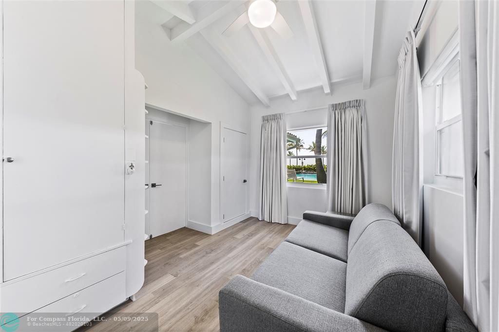 1663 North Fort Lauderdale Beach Boulevard Fort Lauderdale, FL 33305 - Photo 22 of 39 a living room with furniture and a window