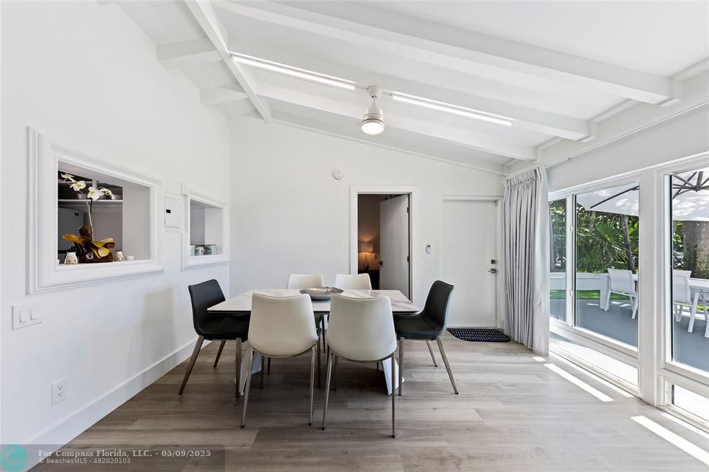 1663 North Fort Lauderdale Beach Boulevard Fort Lauderdale, FL 33305 - Photo 23 of 39 a view of a dining room with furniture window and wooden floor