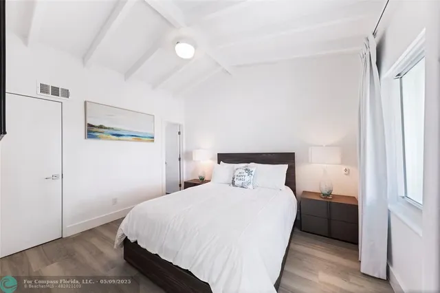 a bedroom with a bed and a cabinets