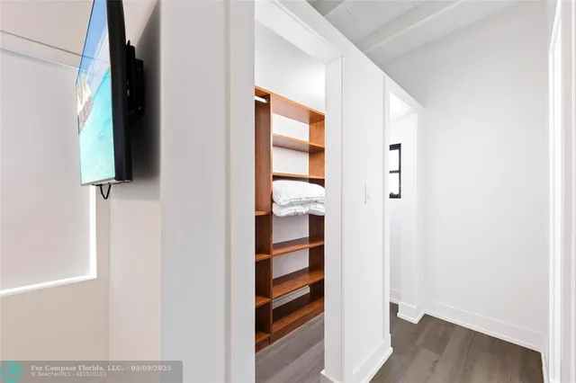 a view of front door with wooden floor