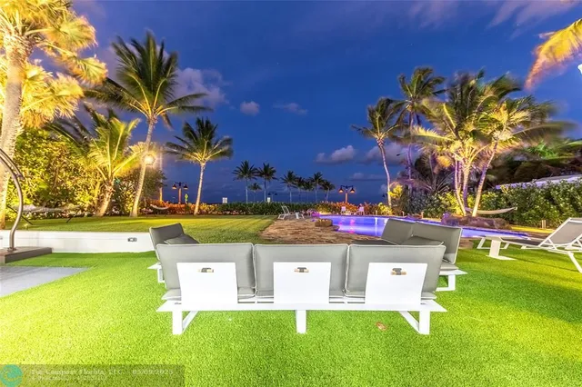 a view of swimming pool with a yard