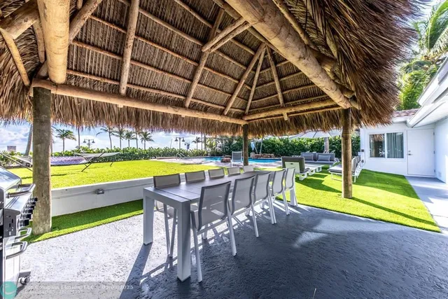 a view of a swimming pool with a lounge chair