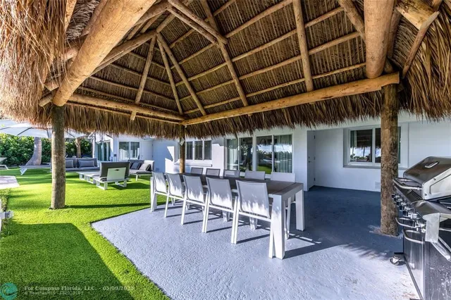 a wooden bench sitting in front of a house