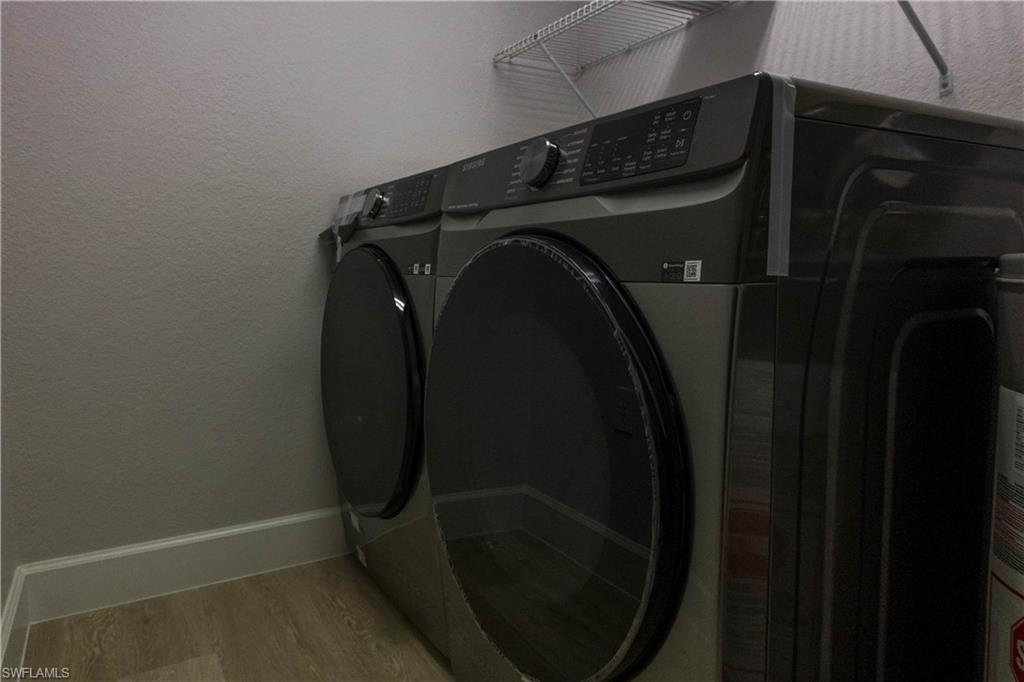 8234 Key Royal Circle, Unit 523 Naples, FL 34119 - Photo 9 of 20 a close up of a washer and dryer