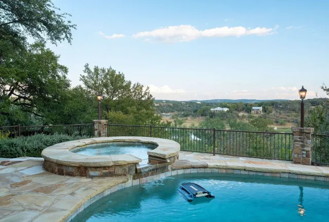 a view of a swimming pool with a patio