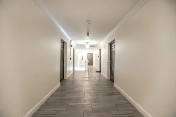 a view of a hallway with a chandelier