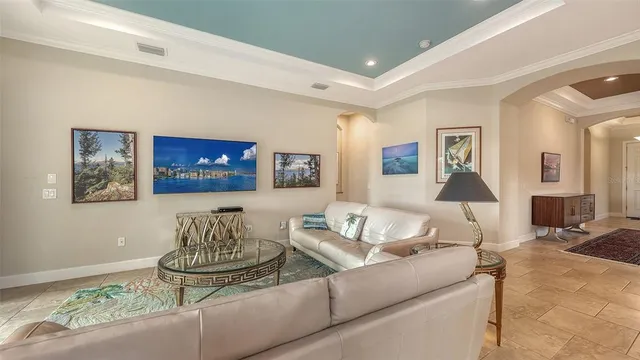 a view of a dining room with furniture and a chandelier