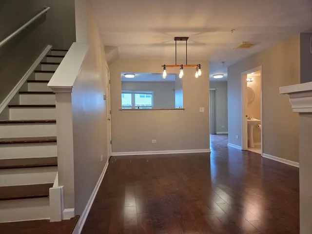 wooden floor in an empty room with a mirror
