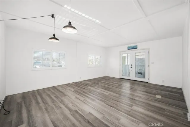 a kitchen with stainless steel appliances a refrigerator and a stove top oven