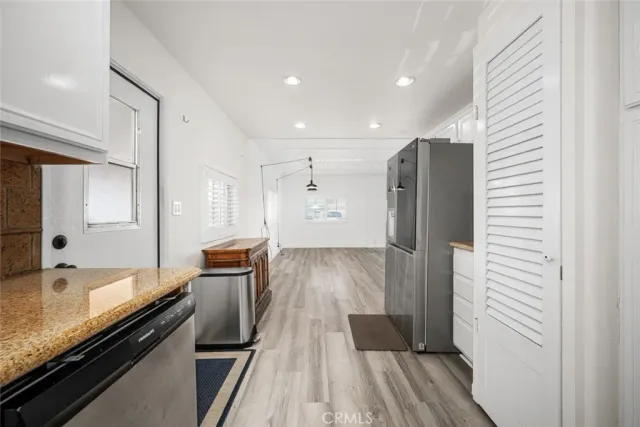 a view of kitchen space with wooden floor