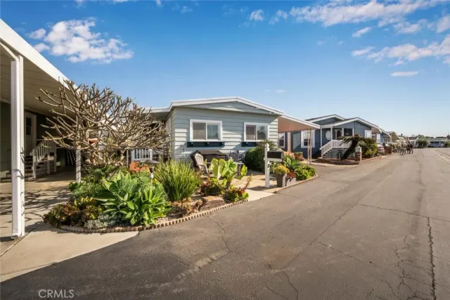 a view of a car park in front of house