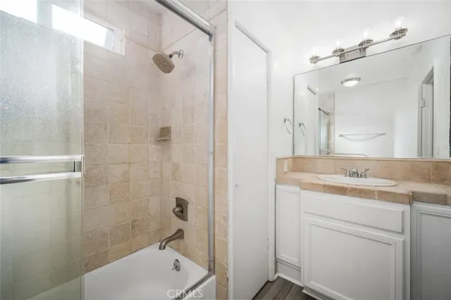 a view of room with window and wooden floor