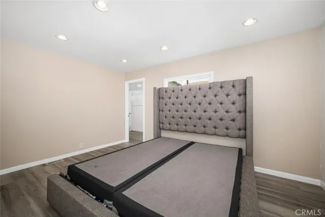 a bathroom with a toilet a sink and a mirror