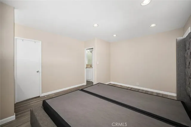 a bathroom with a toilet a sink and a mirror