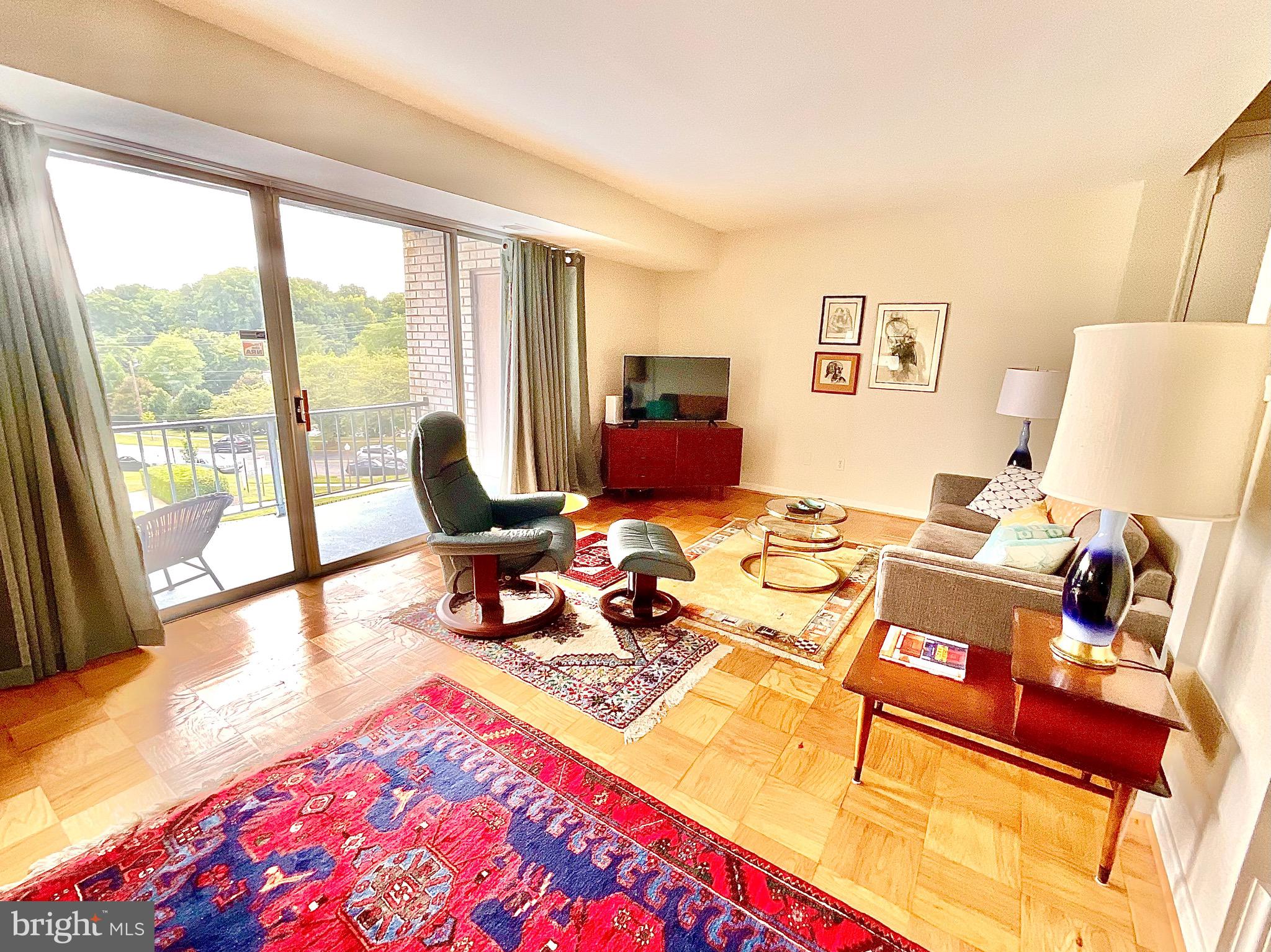 2509 Baltimore Road, Unit 4 Rockville, MD 20853 - Photo 4 of 27 Living Room w/ 15 ft of SGD and glass to balcony