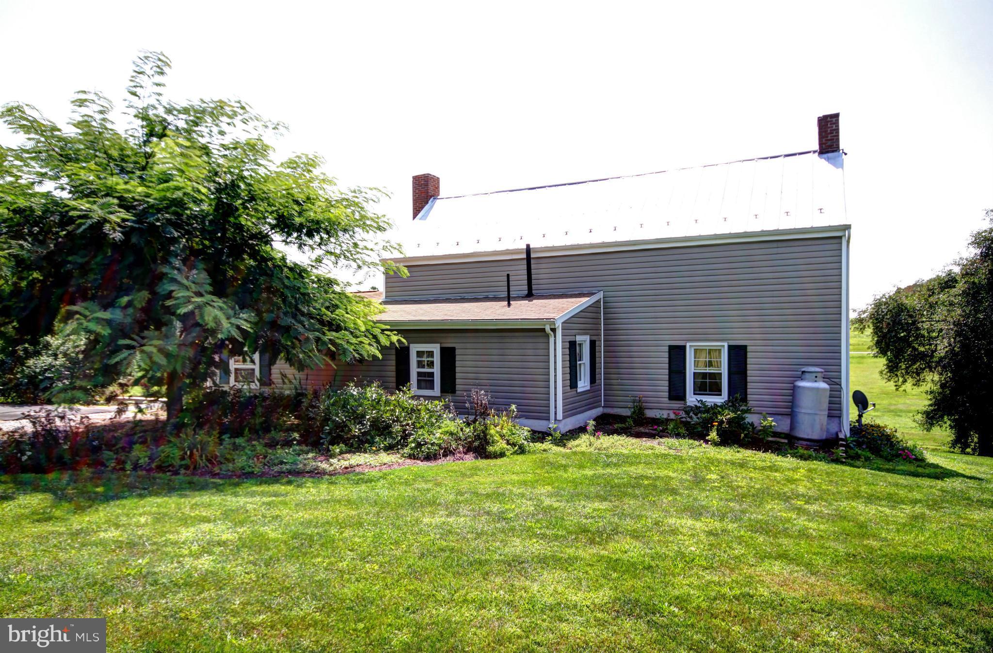 7295 Keysville Road Keymar, MD 21757 - Photo 3 of 25 a front view of house with yard and outdoor seating