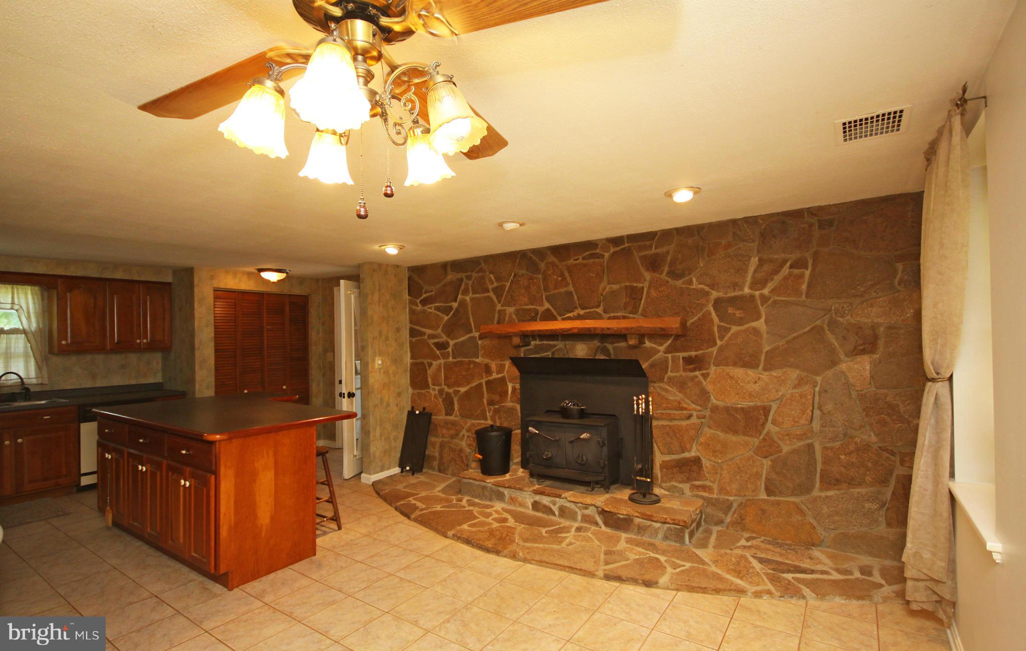 7295 Keysville Road Keymar, MD 21757 - Photo 4 of 25 a open kitchen with a sink and cabinets