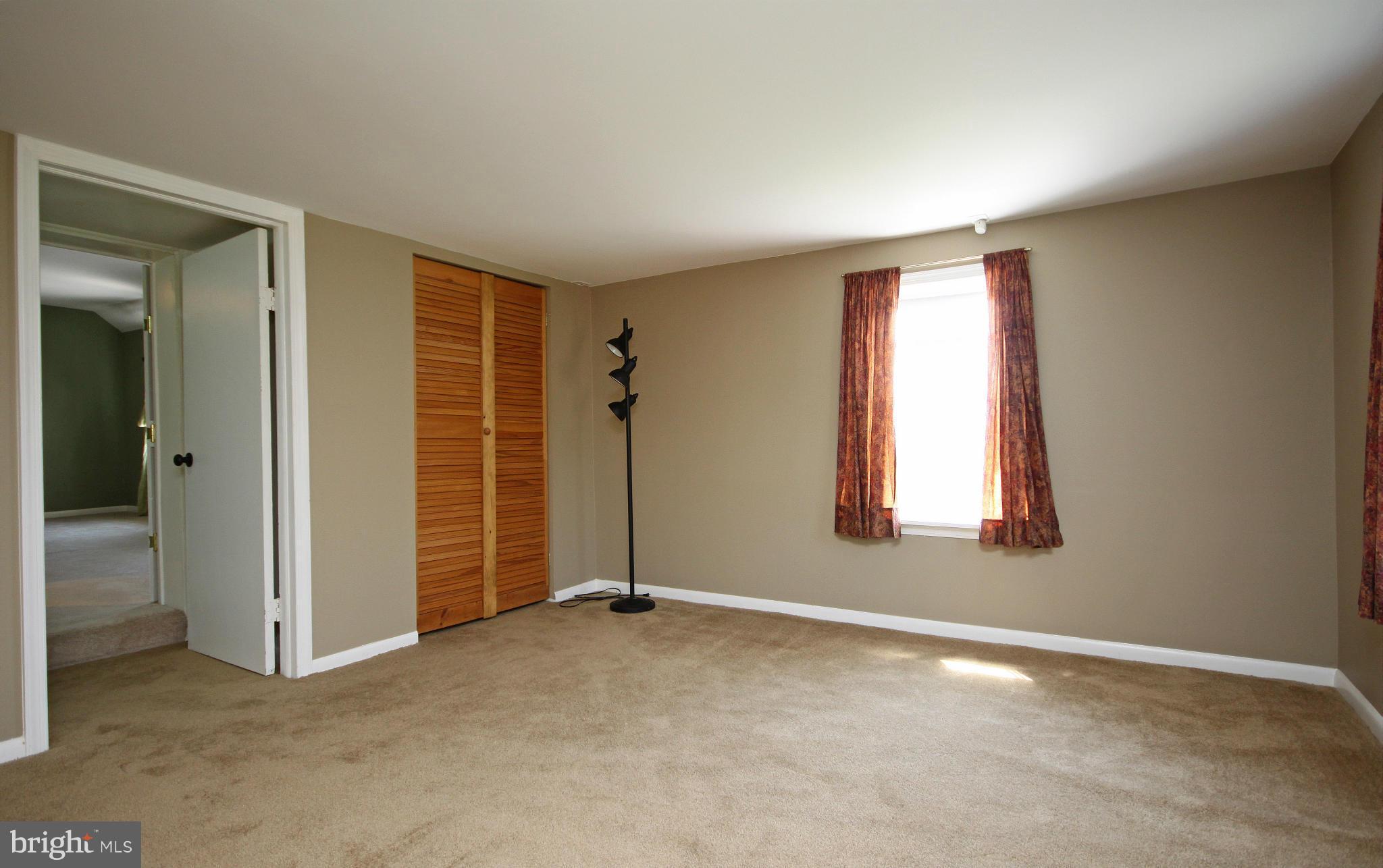 7295 Keysville Road Keymar, MD 21757 - Photo 7 of 25 an empty room with windows and closet
