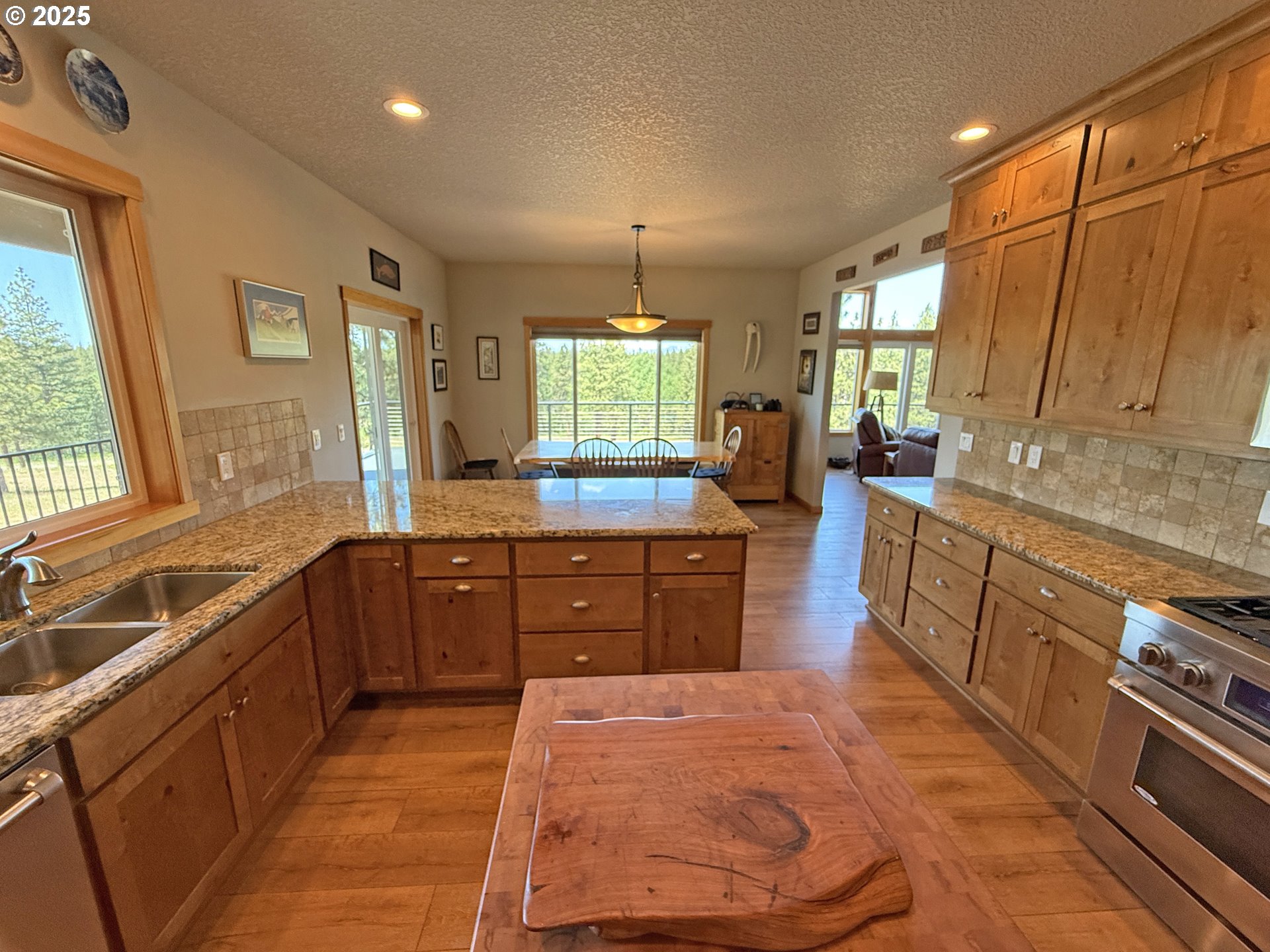 12 Keystone Drive Goldendale, WA 98620 - Photo 22 of 48 a large kitchen with kitchen island granite countertop a large counter top a sink a window and stainless steel appliances