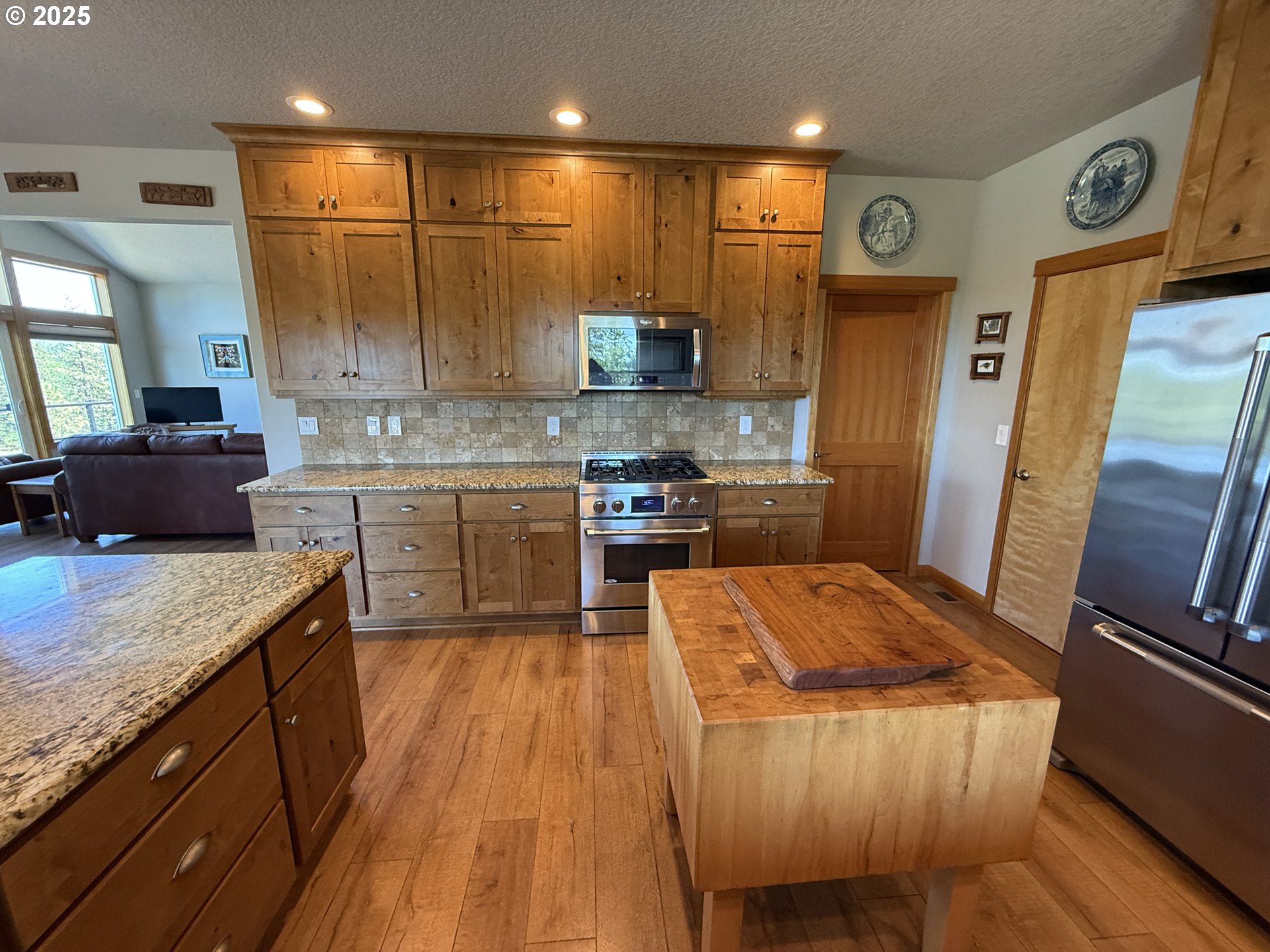 12 Keystone Drive Goldendale, WA 98620 - Photo 23 of 48 a large kitchen with stainless steel appliances kitchen island granite countertop wooden cabinets and a granite counter tops