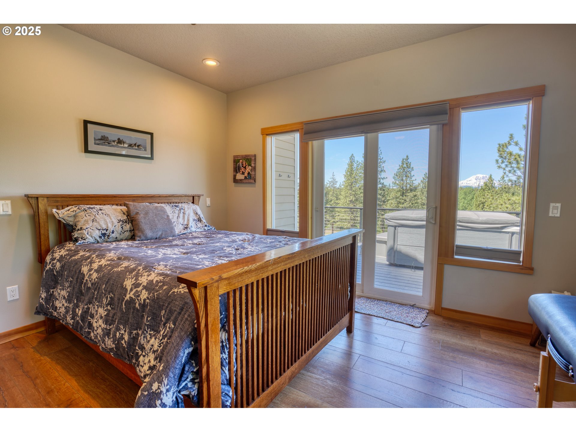 12 Keystone Drive Goldendale, WA 98620 - Photo 26 of 48 a bedroom with a large bed and wooden floor