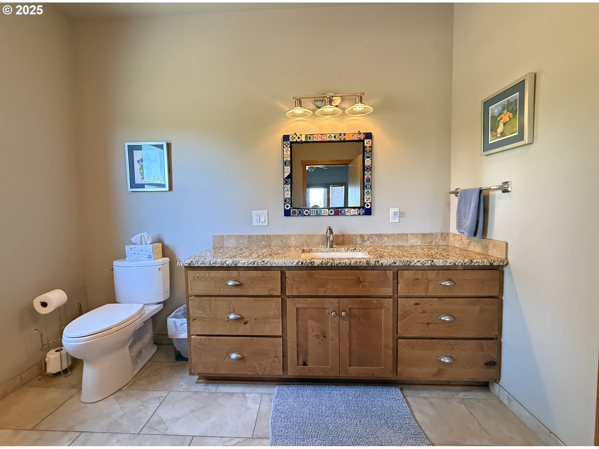 12 Keystone Drive Goldendale, WA 98620 - Photo 28 of 48 a bathroom with a granite countertop toilet sink and mirror