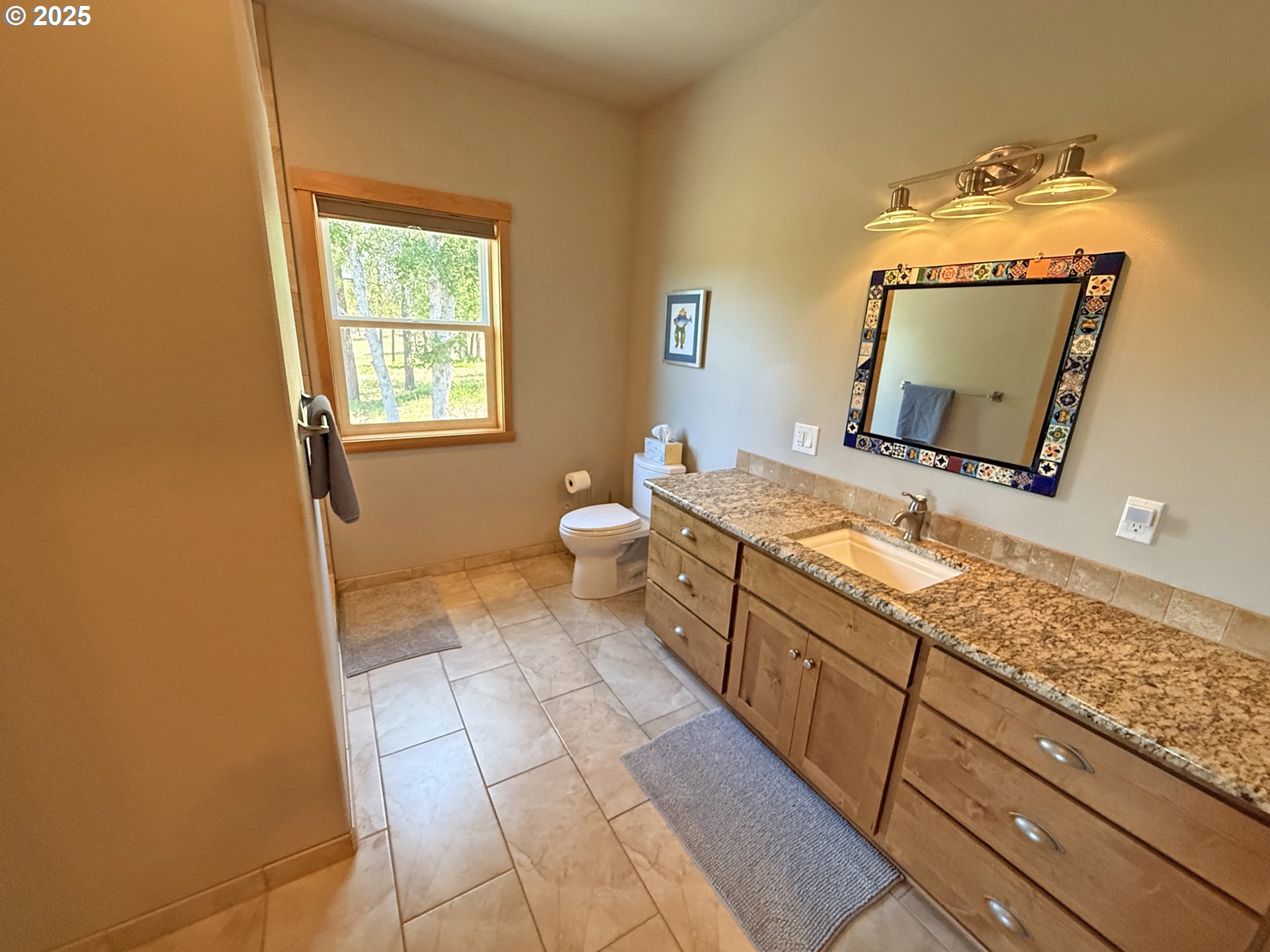 12 Keystone Drive Goldendale, WA 98620 - Photo 29 of 48 a spacious bathroom with a granite countertop sink and a mirror