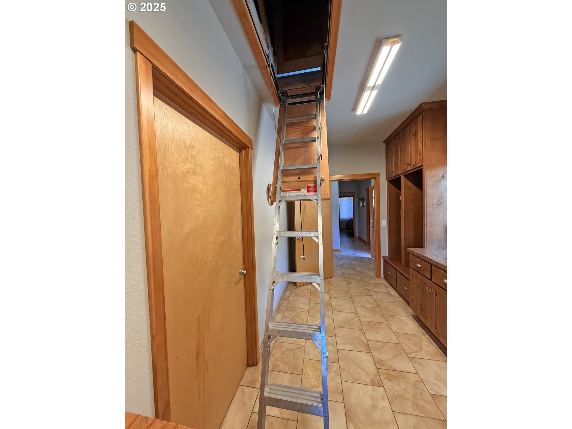 12 Keystone Drive Goldendale, WA 98620 - Photo 36 of 48 a view of a hallway with wooden floor and a bathroom