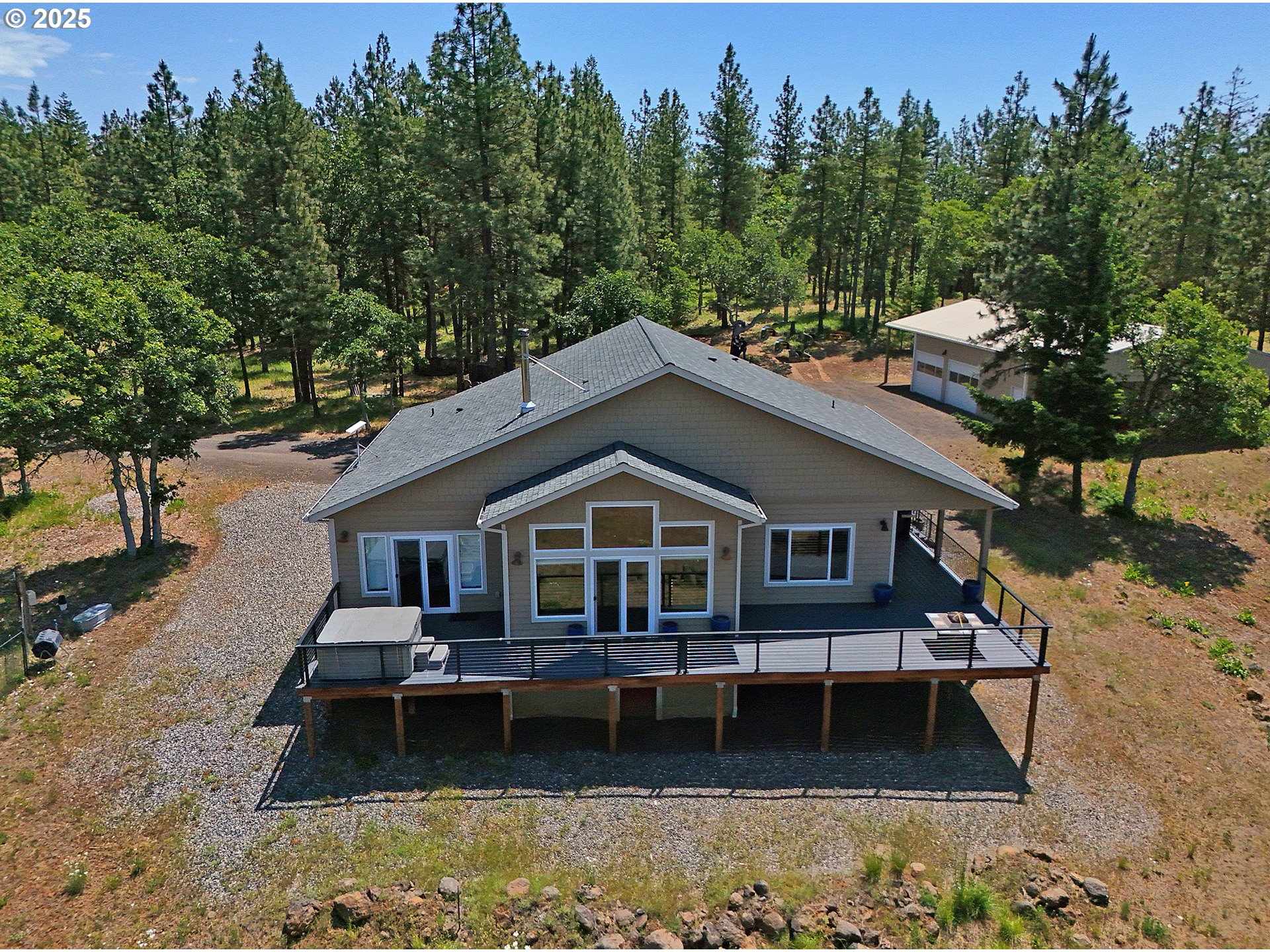 12 Keystone Drive Goldendale, WA 98620 - Photo 40 of 48 a front view of a house with a garden and trees