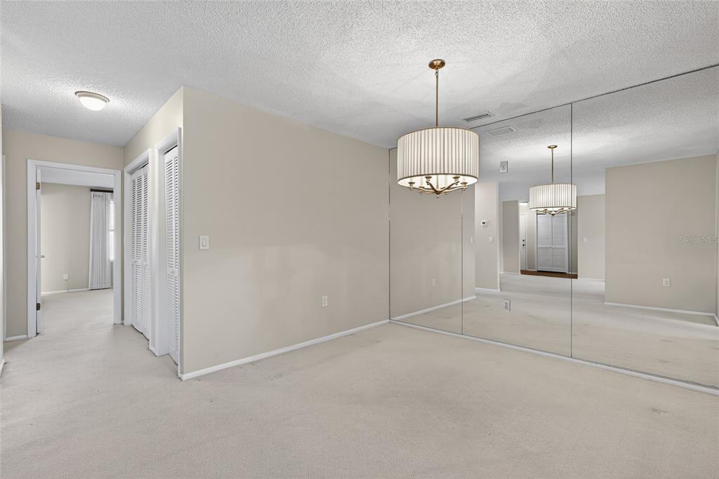 214 Caryl Way Oldsmar, FL 34677 - Photo 18 of 44 a view of an empty room with window and chandelier