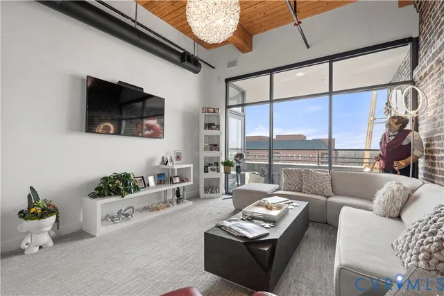 a bed room with a bed and a chandelier