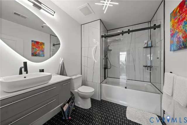 a bedroom with a bed and cabinets