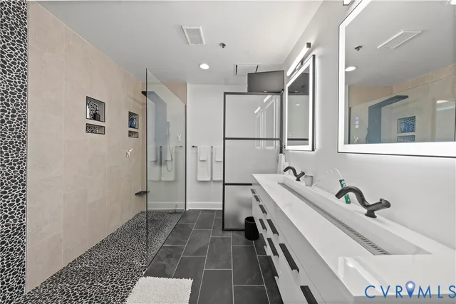 a kitchen with a sink a stove top oven a refrigerator cabinets and a window