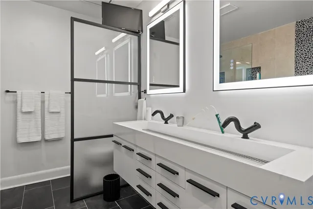 a kitchen with stainless steel appliances a refrigerator sink and microwave