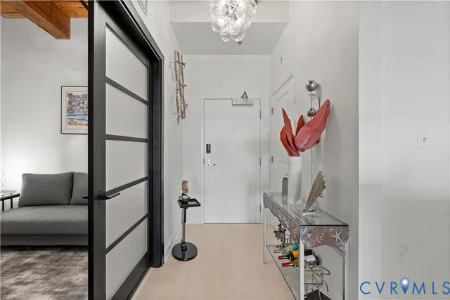 a living room with couches and next to a window